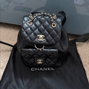 CHANEL Black Quilted Leather Mini Backpack with Gold-Tone Chain